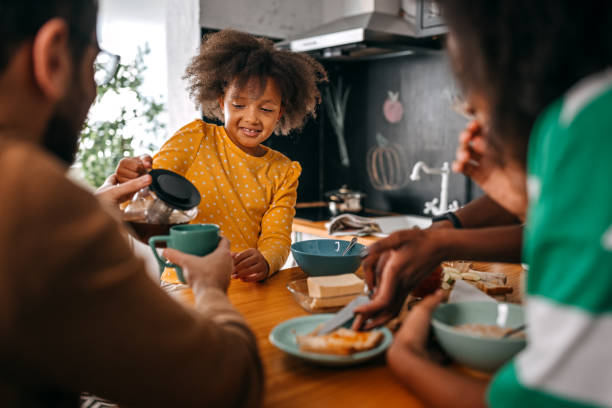 istock Daughter serving coffee to father during breakfast 1360089444
