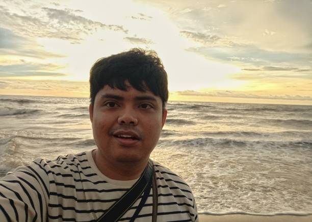 istock a man taking selfie on the beach 1360089449