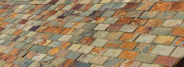 istock Colorful slate tile rooftop. Multi coloured roof slate tiles 1360092186
