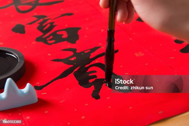 Close Up Of Writing Spring Festival Couplets To Celebrate Chinese New Year Holidays Stock Photo - Download Image Now