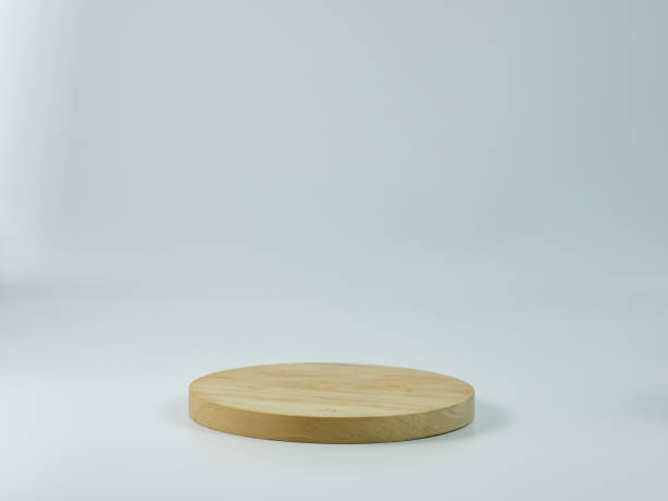 istock round empty wooden plank isolated on white background. Product placement concept 1360105491