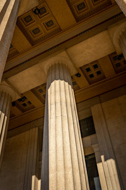 istock Pillars of stability are associated by columns supporting heavy roof 1360108650