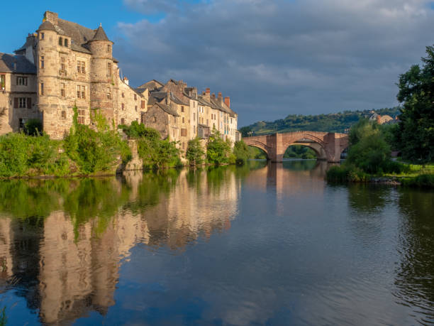 istock Espalion old town reflecting in the Lot river waters 1360110955