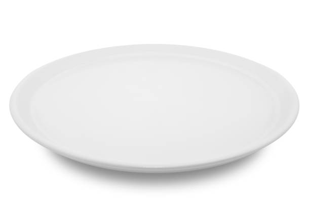 istock White circle ceramics plate isolated on white background. 1360111824