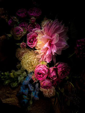 My original vertical closeup photo of a beautiful vibrant bouquet of mixed flowers has been transformed using a Lightroom filter to give a Renaissance ‘still life’ feel to the image