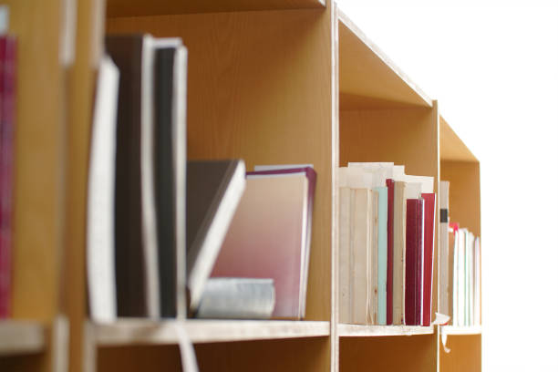 istock Books on a shelf in the library. Selective focus 1360115098