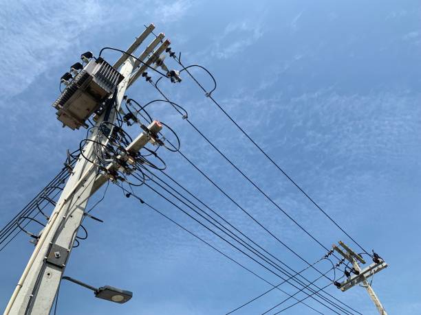 istock The transformer box on electric pole with blue sky 1360116751