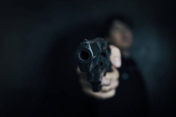 istock Guy is holding revolver in hand. 1360120310