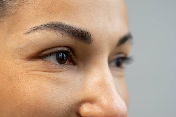 istock Close-up of a black woman's eyes looking sideways 1360121154