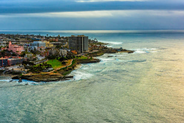 Above the beautiful unique coastline of downtown La Jolla located just north of downtown San Diego shot from an altitude of about 800 feet.