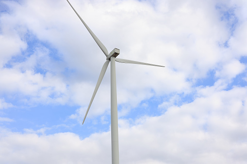 Wind Turbine generator against could sky on windy day,Wind Turbines Windmill Energy transform from kinetic energy to electric energy, green energy concept