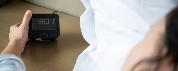 istock Woman snooze the alarm clock 1360126035