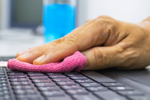 Concept Prevention cleaning frequently, Focus on the high traffic areas that enable pathogens to spread around the computer equipment such as keyboard computer stock photo