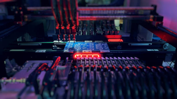 istock Pick and Place robot machine: SMD Assembly of electronic components on a motherboard 1360128662