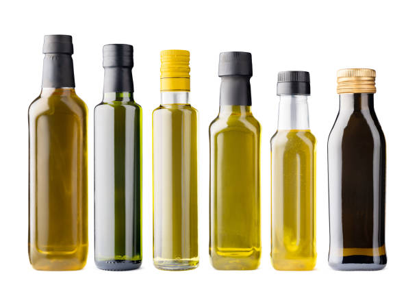 istock Row of olive oil bottles isolated on white 1360131395