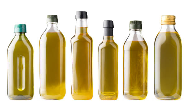 istock Row of olive oil bottles isolated on white 1360131428