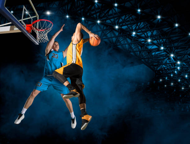 istock Two basketball players in action 1360132445