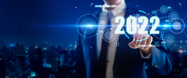istock Smart businessman pointing digital dashboard in 2022 on hologram blue background.Artificial intelligence (AI),machine learning support for enhancing business growth.Futuristic technology trend concept 1360132523