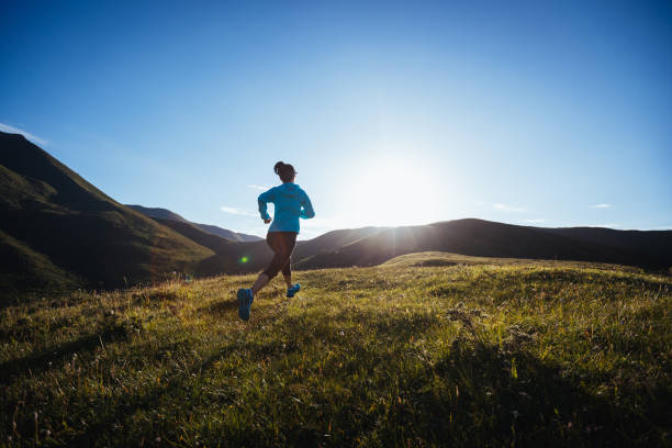 istock Woman ultramarathon runner running at mountain top 1360133598