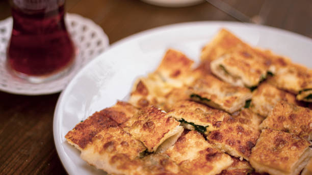 Traditional Sliced Borek and Tea Traditional Sliced Borek and Tea, Cheesy filo pastry stock pictures, royalty-free photos & images