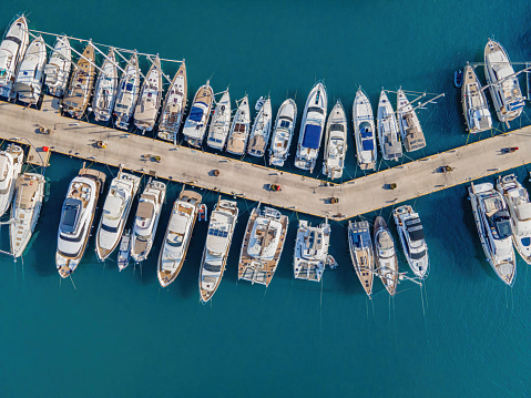 Yacht club. Aerial top-down view of docked sailboats. Top down view of yachts