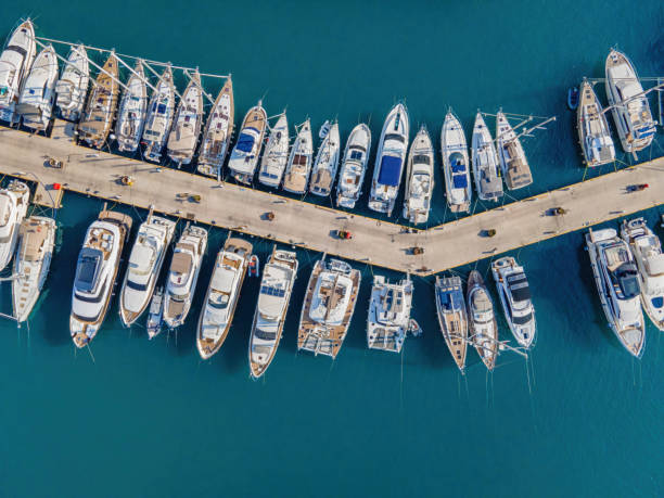 Yacht club. Aerial top-down view of docked sailboats. stock photo