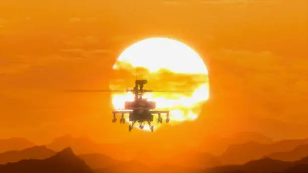 Helicopter Apache AH-64 flying over the mountains at sunset, hot weather, heat distortion.