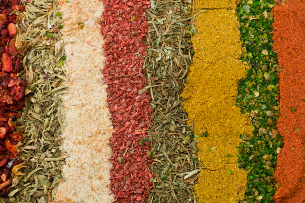 istock variety spices and herbs on background. spices texture. top view 1360139933