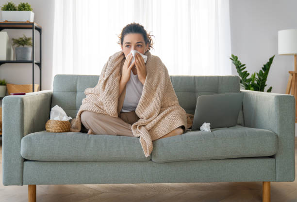 girl is holding paper tissue and blowing nose Ill upset girl is holding paper tissue and blowing nose. Virus symptom concept. allergy stock pictures, royalty-free photos & images