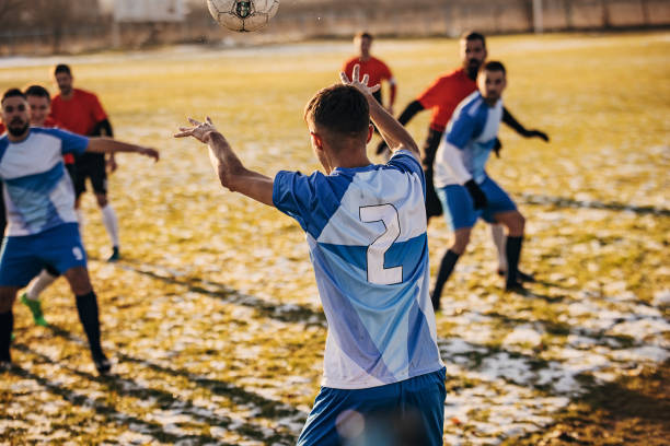 Happy Player With Soccer Ball Jumping On Stadium