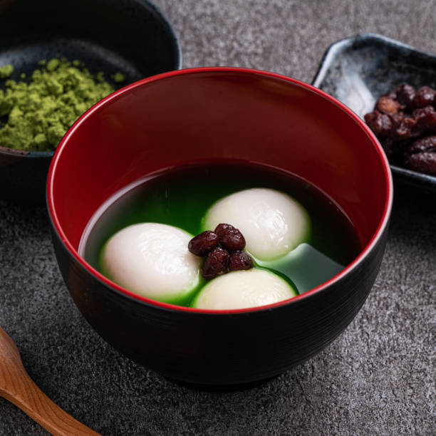 istock Matcha big tangyuan and matcha soup on gray table. 1360142822