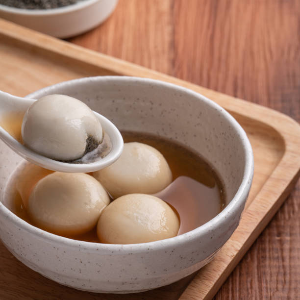 istock Sesame big tangyuan with syrup soup. 1360143381