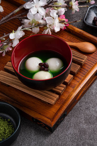 istock Matcha big tangyuan and matcha soup on gray table. 1360144019
