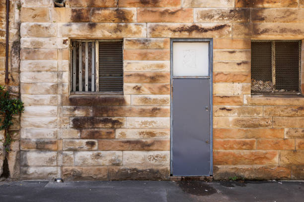 Old stone wall with gray door.