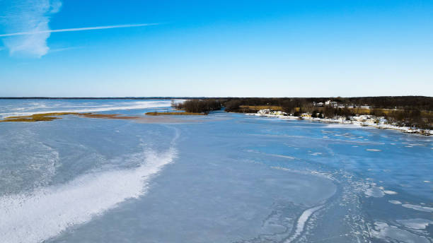 istock Vibrant blue sky overlooking frozen lake 1360148005