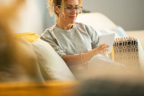 istock Midsection Of Woman Using Mobile Phone 1360149120