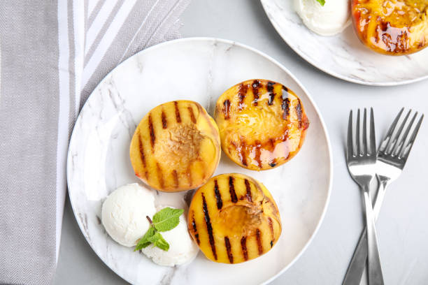 istock Delicious grilled peaches with ice cream and honey on grey table, flat lay 1360150728