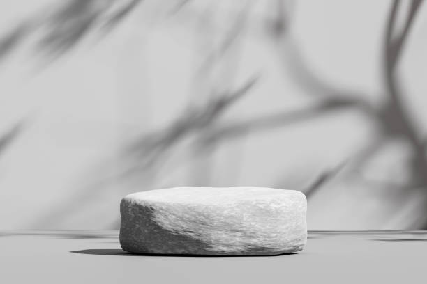 istock Gray stone podium background or abstract empty sunny product display platform for advertising concrete space and blank minimal stage showcase pedestal on rock backdrop scene with natural beauty stand. 1360150831