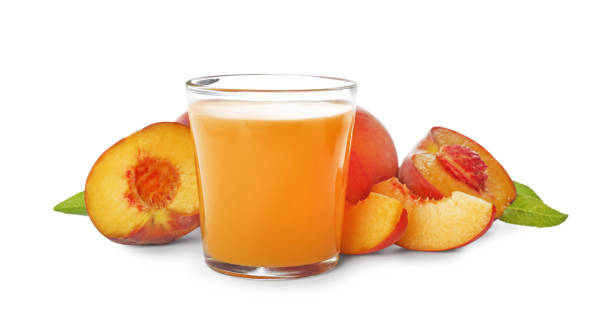 istock Freshly made tasty peach juice on white background 1360152201
