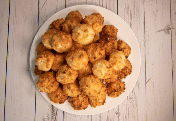 istock Rocher coco from coconut dessert in brown color make with white eggs and sugar. 1360153004