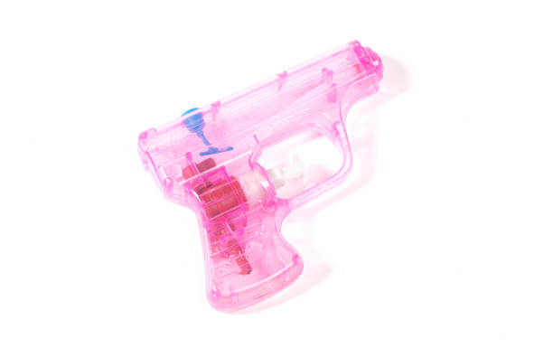 istock SImple pink small water pistol isolated on white 1360153218