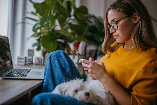 istock Young woman using smart phone 1360157304