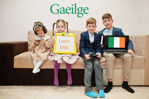 Four kids show inscription learn irish. Foreign language learning concept. Gaeilge.