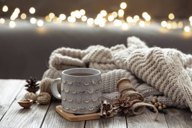 istock Beautiful christmas cup and candles on blurred background with bokeh. 1360158753