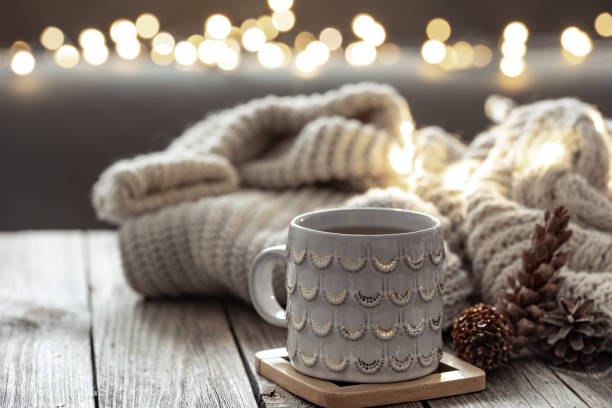 istock Beautiful christmas cup and candles on blurred background with bokeh. 1360158757