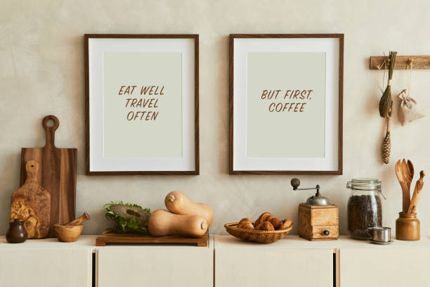 istock Stylish and modern kitchen interior composition with mock up poster frames, beige wooden sideboard, vegetables and retro inspired accessories. Template. Autumn vibes.