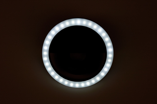 Selfie ring light LED lamp for smart phone in the dark background