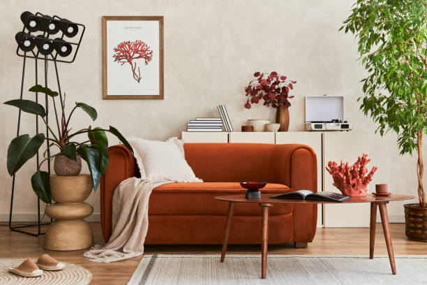 istock Extraordinary living room interior composition with retro designed sofa, wooden coffee table, industrial lamp, plants and stylish personal accessories. Modern concept. Template. 1360163384