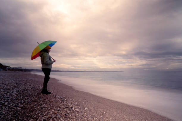 istock LGBT Woman Facing The Sea 1360164096