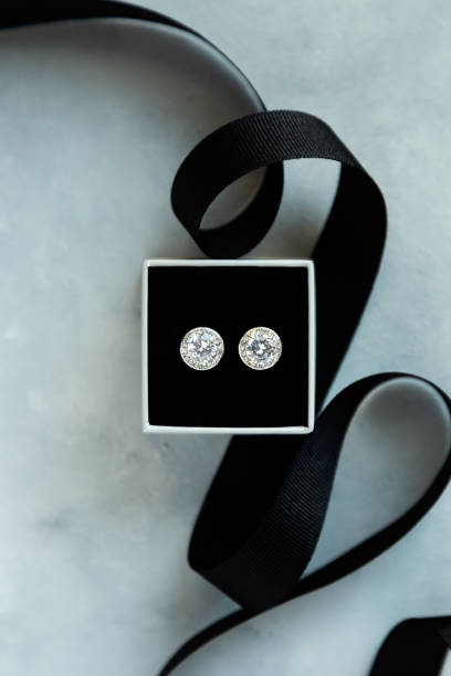 earrings in a box photography showing diamond earrings in a box diamond earring stock pictures, royalty-free photos & images